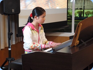 New member, Phoebe Zhang, played two classical pieces for us on our Clavinova CVP-509. this was Phoebe's debut at the Club. Phoebe is just 10 years of age but playing wonderfully! Photo courtesy of Dennis Lyons.