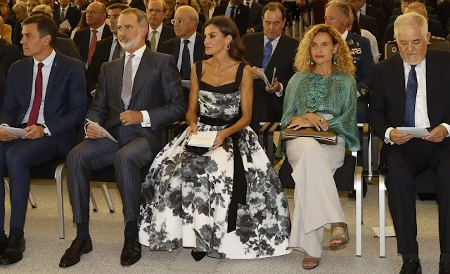 Queen Letizia wore a new floral bow a-line cocktail dress by Carolina Herrera. King Felipe and Prime Minister Pedro Sanchez