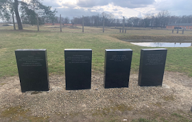 4 gravestone monuments.
