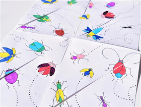 na zdjęciu zbliżenie pociętej w trójkąty kartki z wizerunkami pokolorowanych biegających owadów