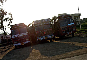 three painted trucks