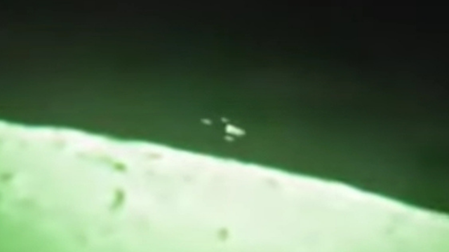 Close look at the UFO passing the Moon.