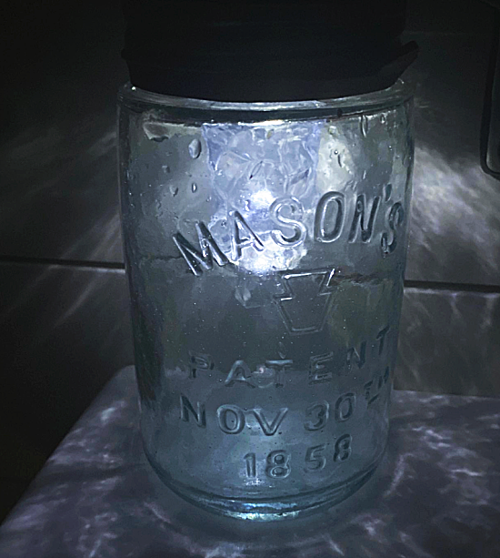 blue mason jar light at night