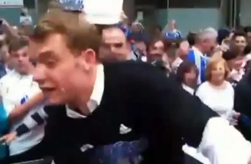 Manuel Neuer reacts after being slapped by an angry Schalke fan