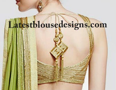 gold blouse with tassels