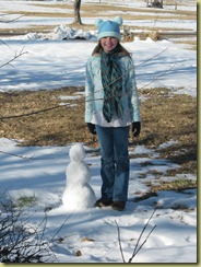 Celine with her snowman.