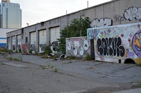 Former Bayside Oil garage and shop with graffiti on it