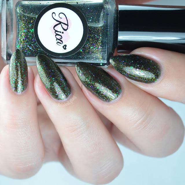 black nail polish with green and blue glitter