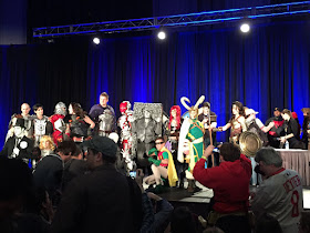 Photo of the winning and honorable mention cosplayers on stage after the costume contest.