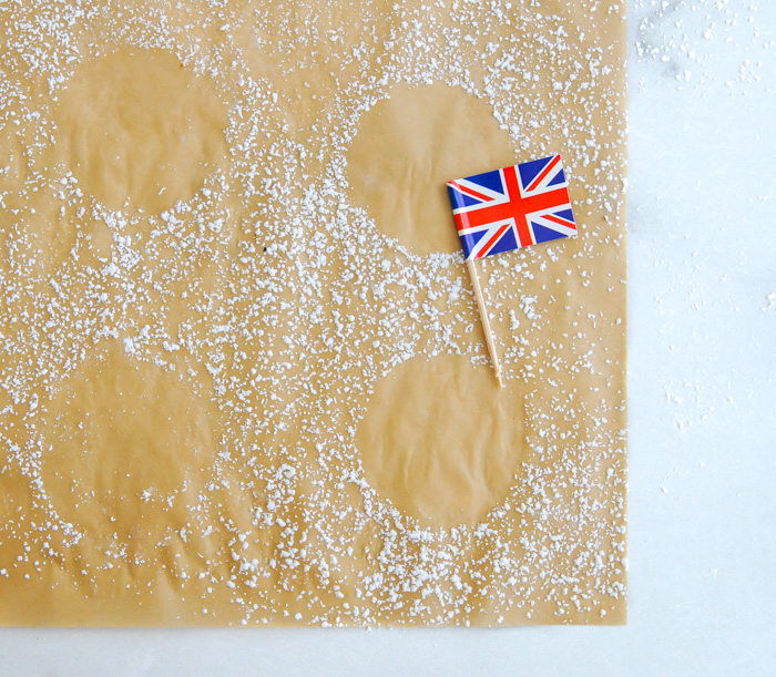 powdered sugar circles on parchment with British flag