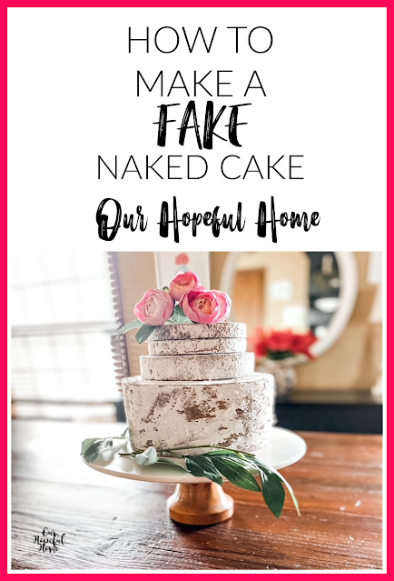 fake naked cake topped with pink peonies