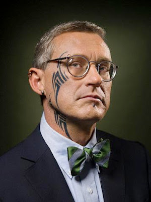 Tribal Tattoo Body Art A glasses man with cool tribal tattoo from face to