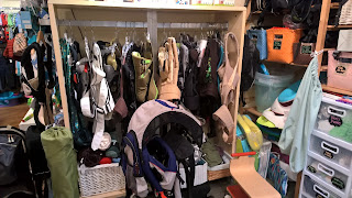 baby carriers hanging at childish things baby consignment store