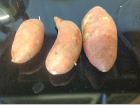3 uncooked sweet potatoes on the counter