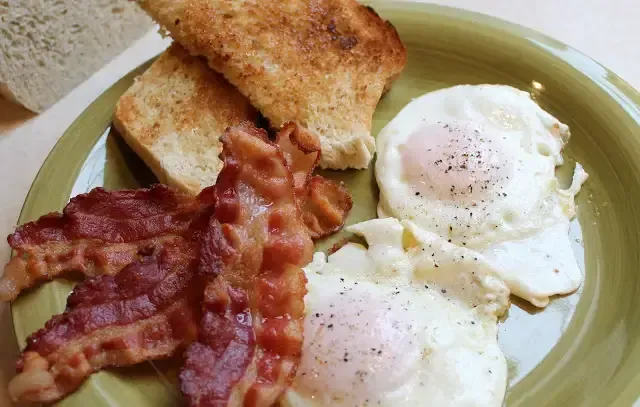 Can you suggest some breakfast recipes that include a large amount of bacon?