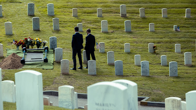 two men at a military cemetery