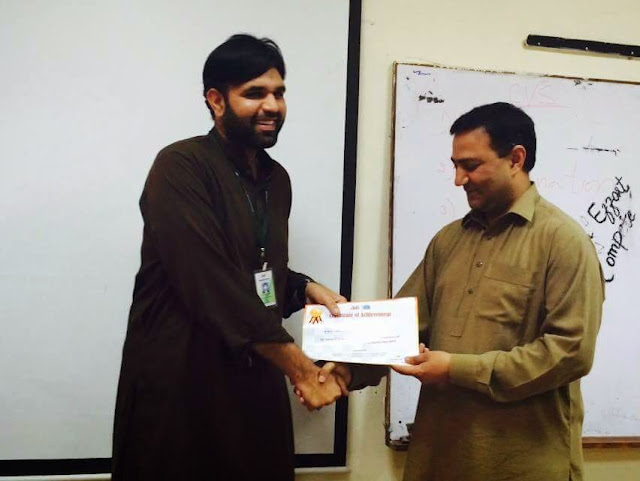 Sir Naeem Recieving cert from HOD at bmb sports gala