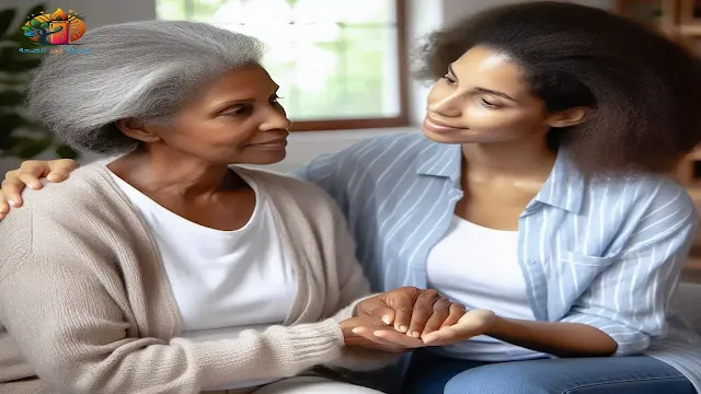 مقدم رعاية يدعم بلطف مريض زهايمر في المراحل الأولى، يوضحان أهمية التعامل الإيجابي