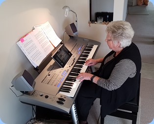 Our host, Barbara Powell, playing her Yamaha Tyros 5.