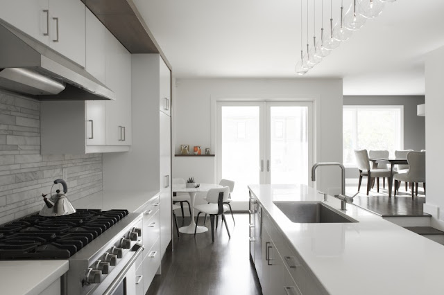 Picture of the minimalist kitchen with white and gray furniture