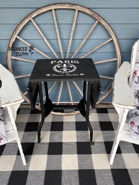 Photo of a painted & stenciled vintage typing table on the covered patio