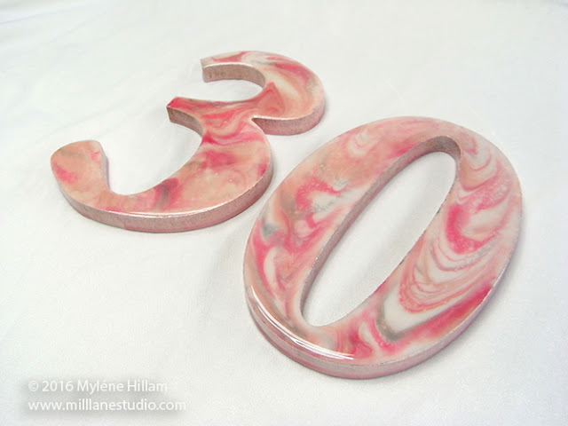 Wooden numerals (30) marbled with pink, silver and white resin for a 30th birthday.