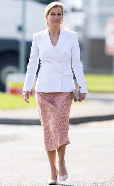 The Countess of Wessex wore a new white Indiana jacket by Altuzarra, and tweed side-drape midi skirt by Victoria Beckham