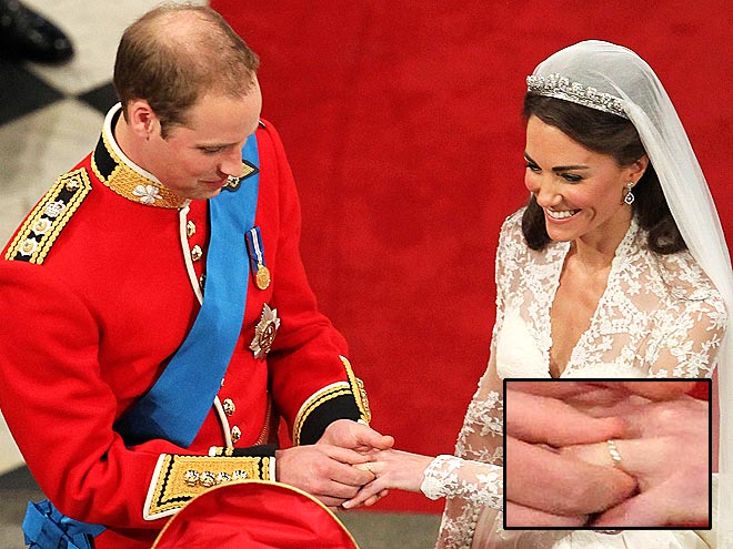 William slips a gold wedding band made from the royal family 39s private Welsh