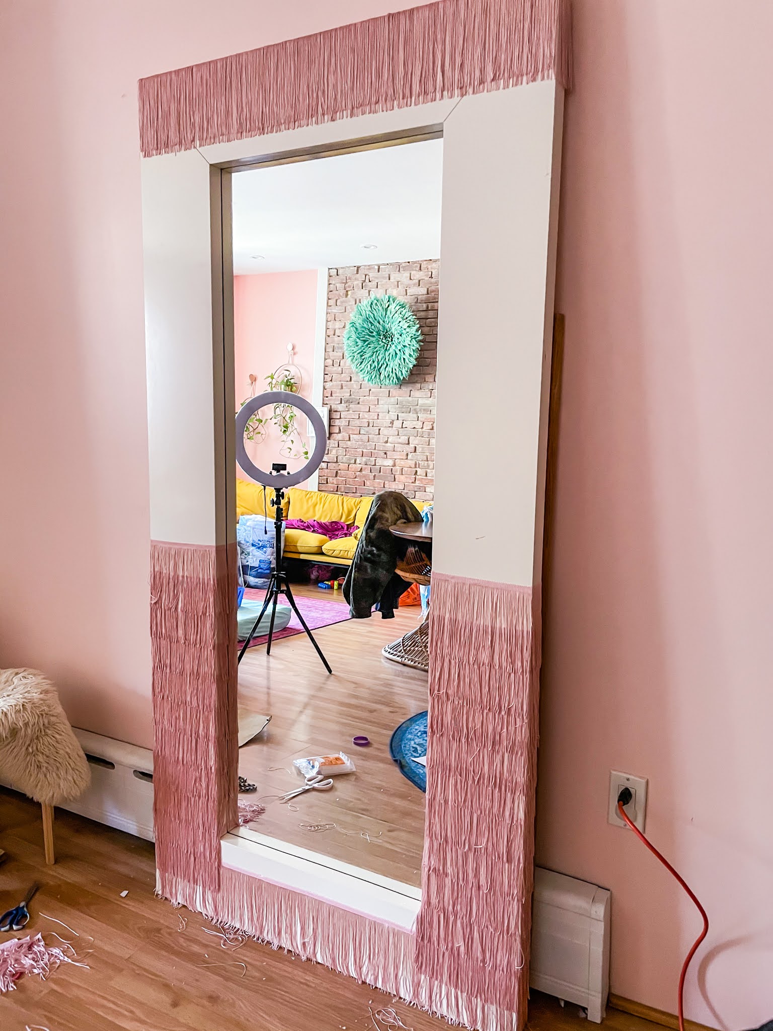 Ikea Hack // Ikea Mirror Hacks // Fringe Mirror // DIY fringe mirror // DIY floor length fringe mirror // floor length fringe mirror // pink fringe mirror // fringe diy // Megan Zietz // tfdiaries // easy ikea mirror epicycle // easy ikea mirror hack // easy ikea hacks // colorful homes // pink mirror // diy pink mirror // fringe mirror tutorial // budget friendly mirror diy // ikea mongstad mirror diy // ikea mongstad mirror hack // ikea mongstad