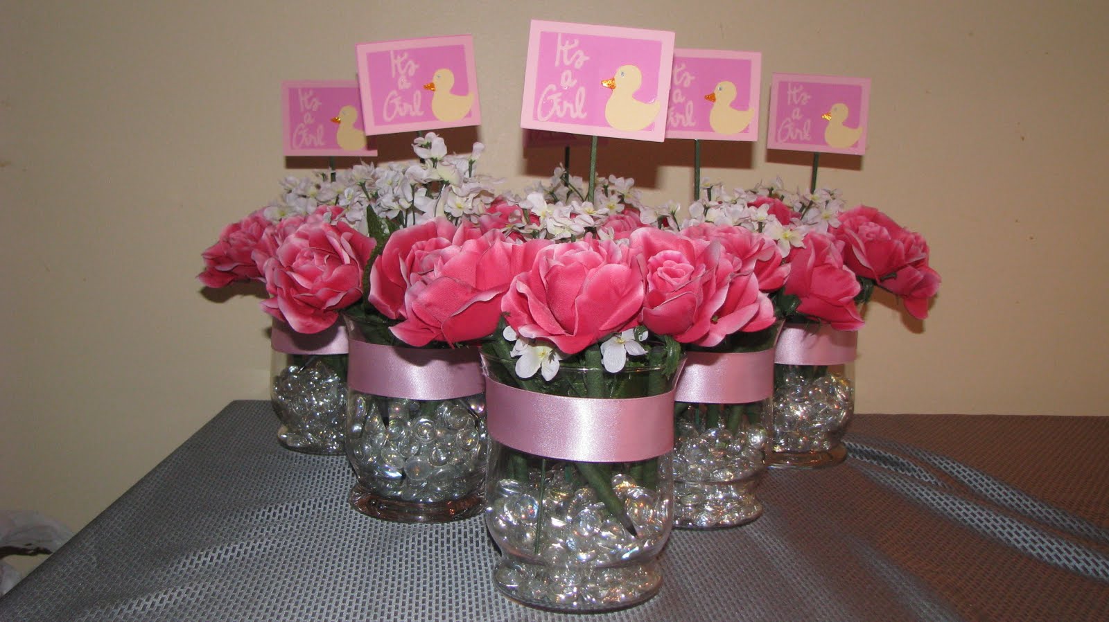  if i would make the centerpieces for a baby shower she is hosting for