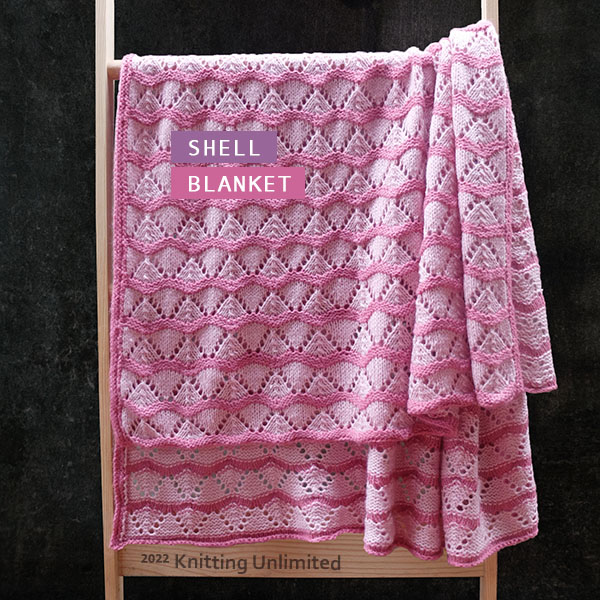 Knitting Unlimited Blanket 20: Shell Lace pattern. Approx. 43”x 50”. Worsted Yarn: 1100-1200m