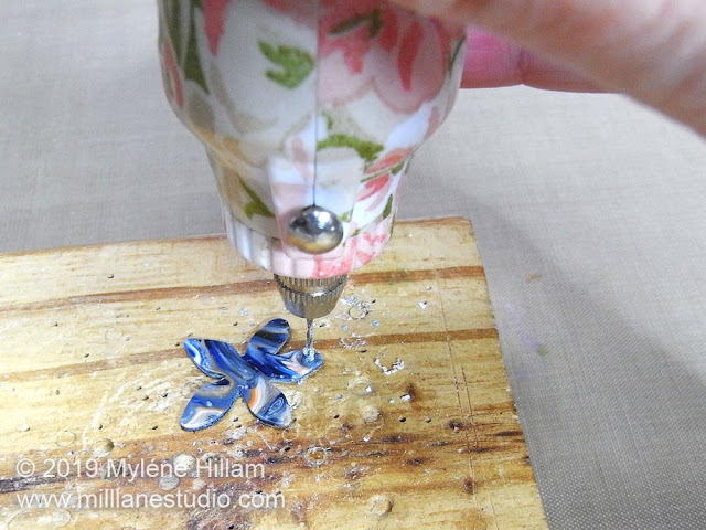 Drilling a hole in the tips of the resin petal