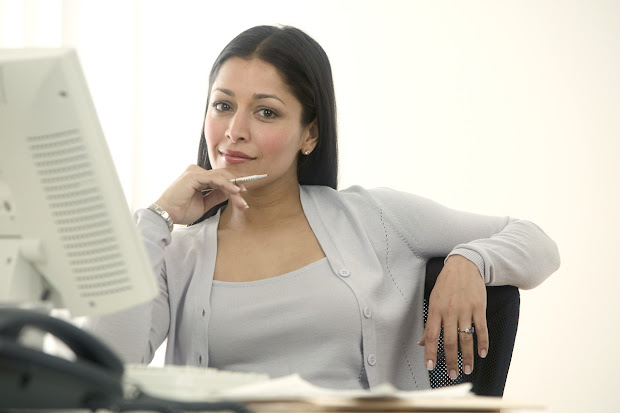 Woman Thinking at computer about Website Layout doing things because it is very easy to navigate