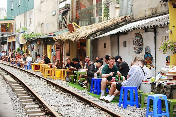 People Beside Train Railway