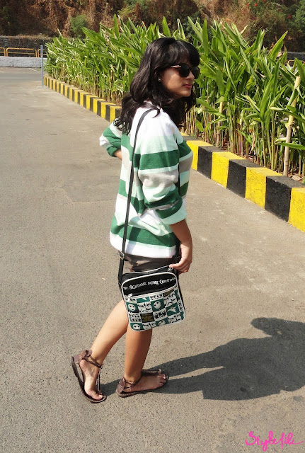 The personal style of Dayle Pereira who is the blogger at Style File includes an Adidas Originals striped pullover knit, Espirit shorts, Montego Bay Sandals and a Nightmare Before Christmas sling bag for a relaxed day out