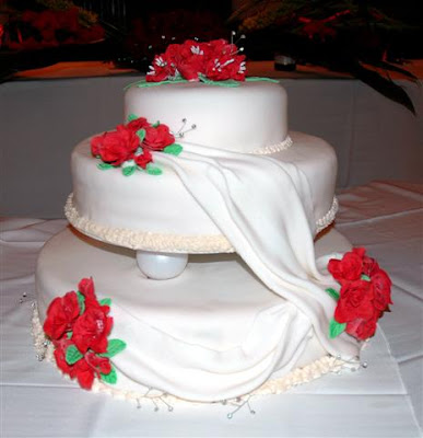 3 Tier Wedding Cake Top layer covered in fantasy flowers