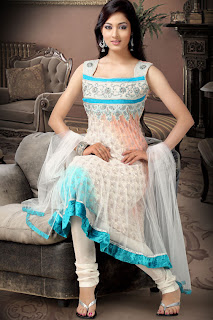 a woman wearing a churidar white designer anarkali suit