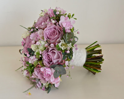 Vintage styled bouquet in dusky pinks mauve with lace wrap