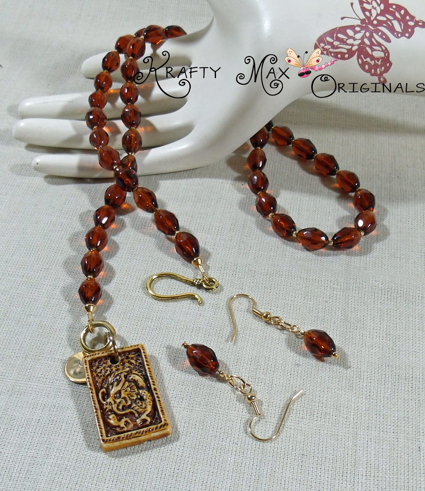 http://www.lajuliet.com/index.php/2013-01-04-15-21-51/ad/sets,85/exclusive-brown-ceramic-dragon-and-glass-beads-necklace-set-a-krafty-max-original-design,121