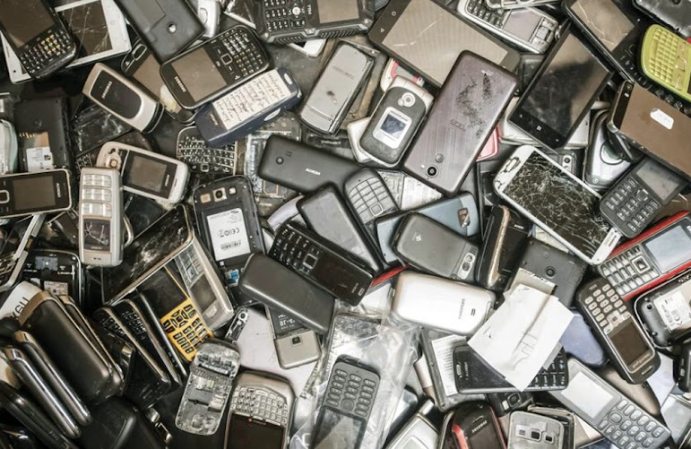 On July 13, 2018, discarded mobile phones fill a dumpster at the Out Of Use company warehouse in Beringen, Belgium. The use of lithium in rechargeable batteries for electric and hybrid cars, lawnmowers, power tools, and other applications has sparked a surge of interest in the past few years. Laptops and cell phones are also powered by lithium batteries.