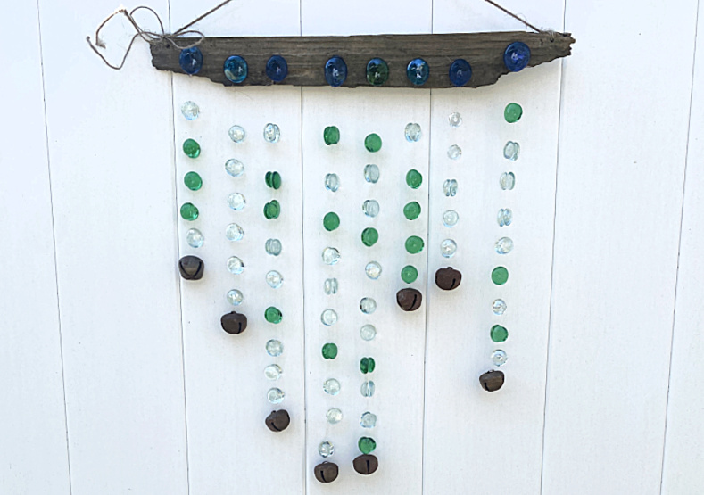 glass bead wind chime on fence