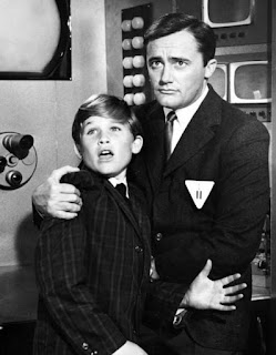 Russell con Robert Vaughn, 1964