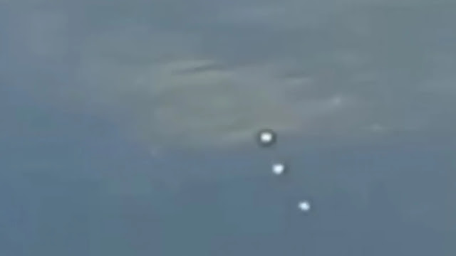 The 3 UFO Orbs appeared just after the first 4 UFOs appeared and disappeared all filmed from the window of an airplane.