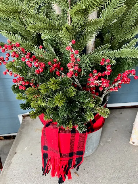 Photo of ice berry picks added to a Christmas Porch Pot.