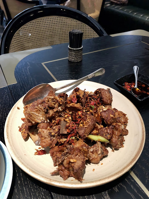 Carcass of the duck fried with garlic and chili