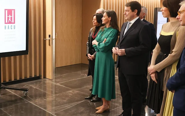 Queen Letizia wore a camel wool straight double-faced coat by Carolina Herrera, and green ranglan midi dress by Dandara