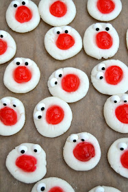 cream cheese, icing sugar and almond extract whipped into a dough and topped with a cocktail cherry - all in aid of Red Nose Day