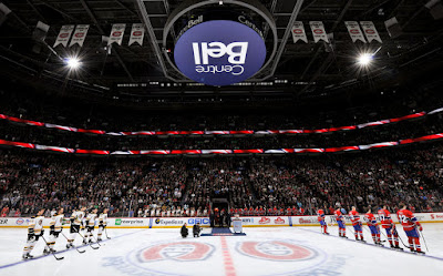 Bruins and Canadiens players lined up at Bell Centre during national anthems