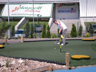 Playing minigolf at the Trafford Golf Centre during the Mini Open tournament in 2009