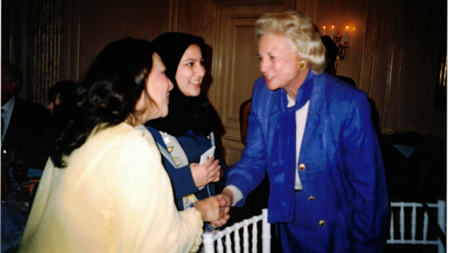 Supreme Court Justice Sandra Day O’Connor and a younger Noorain Khan and her mother greet one another with smiles and a ha